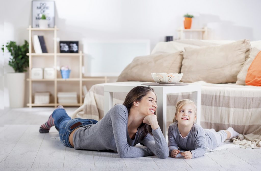 Mother and daughter in living room