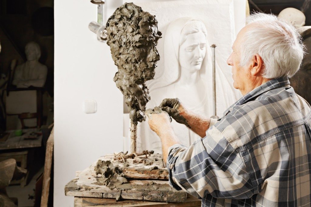 Man sculpting a statue