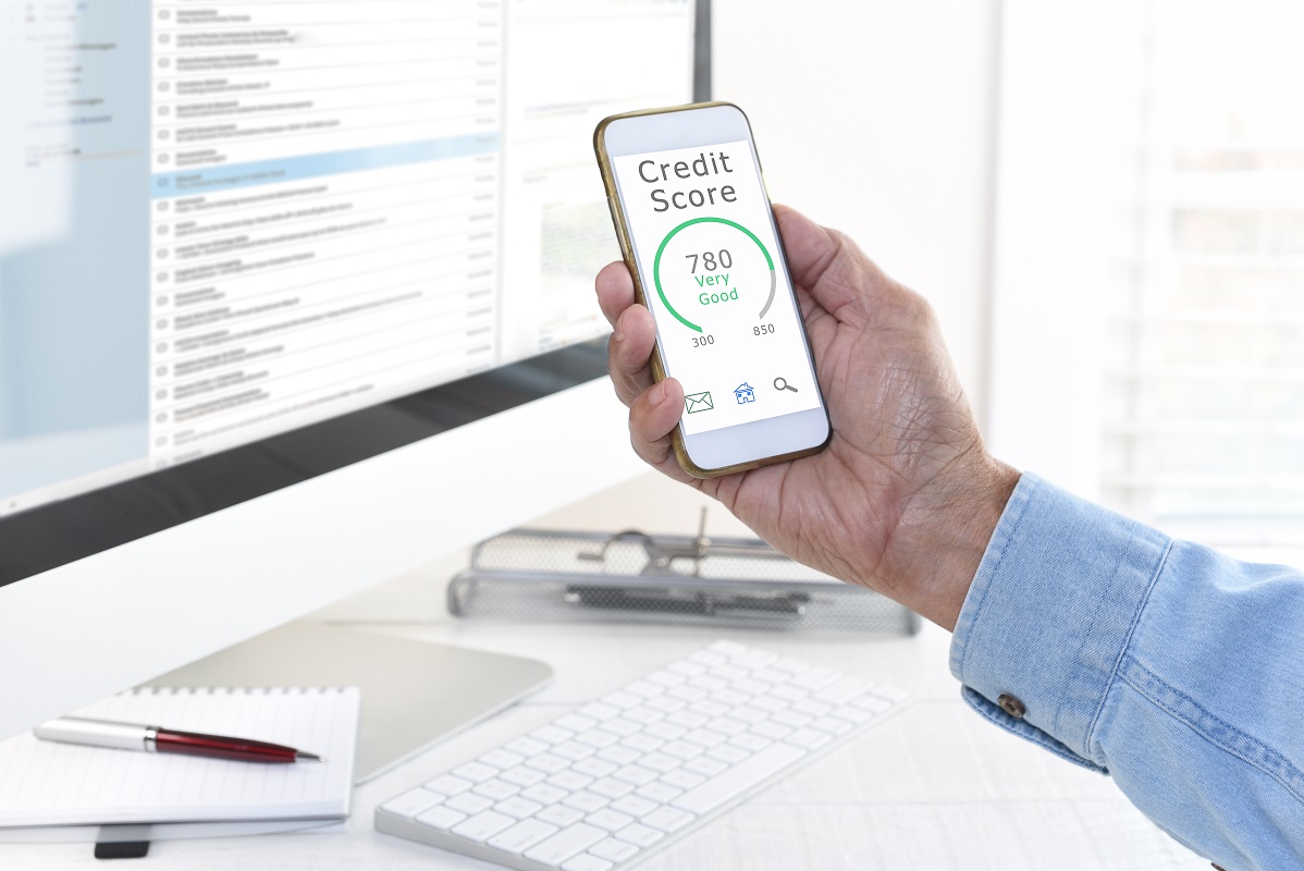 Credit Score Concept. Closeup of a man checking his score on his cell phone.