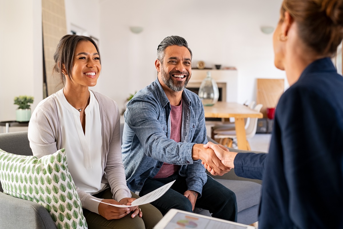 husband handshaking real estate agent