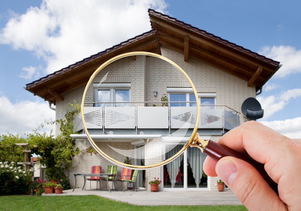 Magnifying Glass Over Luxury House
