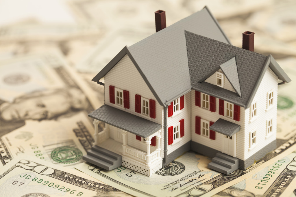 Home model on top of dollars
